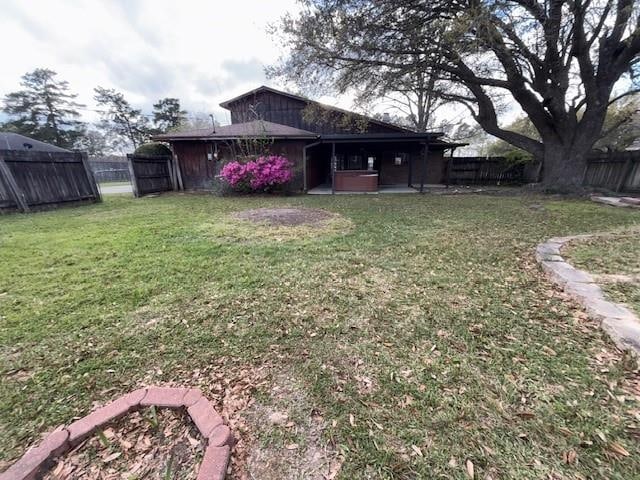 view of yard featuring a patio and a fenced backyard