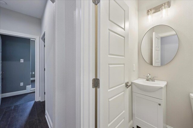 3730 Loblolly Trl, Beaumont, TX 77713 - bathroom with vanity, toilet, and baseboards