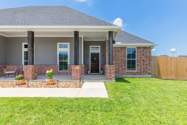 4813 Augusta Dr, Groves, TX 77619 - view of front of house featuring brick siding, roof with shingles, and covered porch