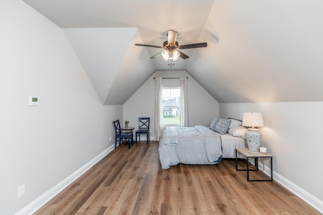 4813 Augusta Dr, Groves, TX 77619 - bedroom featuring light wood-type flooring, lofted ceiling, and a ceiling fan