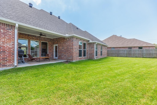 4813 Augusta Dr, Groves, TX 77619 - rear view of property featuring brick siding, a ceiling fan, a shingled roof, and a patio area