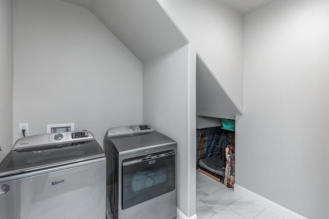 4813 Augusta Dr, Groves, TX 77619 - laundry area featuring washing machine and clothes dryer and light marble finish floors