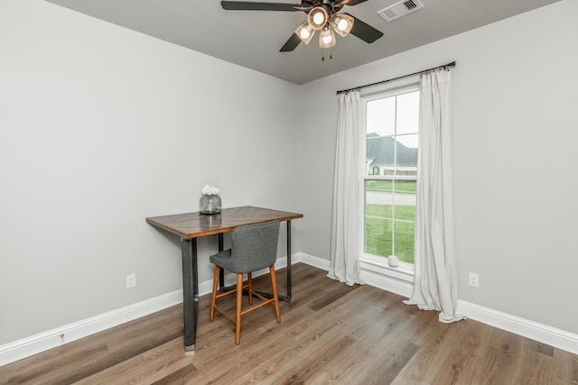 4813 Augusta Dr, Groves, TX 77619 - home office featuring wood finished floors, ceiling fan, and plenty of natural light