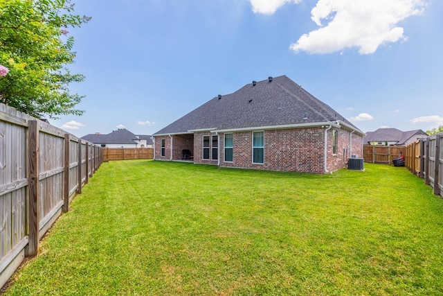 4813 Augusta Dr, Groves, TX 77619 - rear view of property with brick siding, a fenced backyard, and roof with shingles