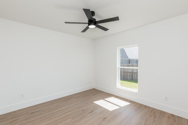 3580 Lily Ln, Beaumont, TX 77713 - empty room with light wood-style floors, baseboards, and ceiling fan