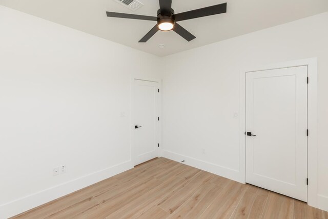 3580 Lily Ln, Beaumont, TX 77713 - spare room featuring light wood finished floors, ceiling fan, and baseboards