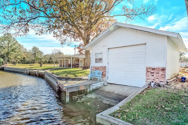845 Flicker St, Bridge City, TX 77611 - detached garage with a water view