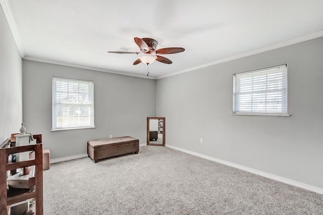 living area with carpet, ceiling fan, and crown molding