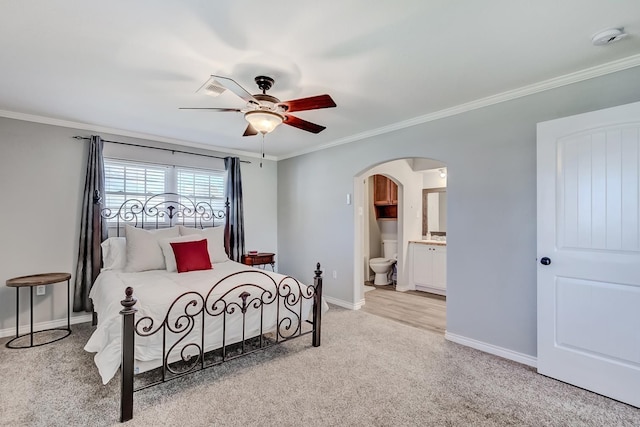 845 Flicker St, Bridge City, TX 77611 - bedroom with arched walkways, ornamental molding, light colored carpet, connected bathroom, and a ceiling fan