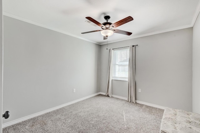 unfurnished room with carpet flooring, ceiling fan, and ornamental molding