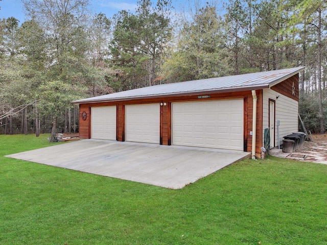 garage featuring a yard