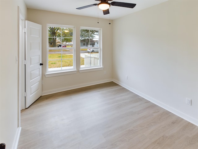 empty room featuring ceiling fan and light wood-type flooring