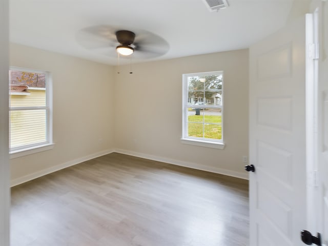 unfurnished room featuring ceiling fan and light hardwood / wood-style floors