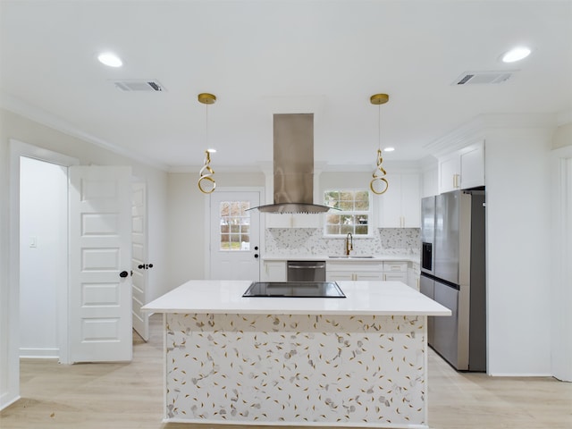 kitchen featuring sink, pendant lighting, island exhaust hood, stainless steel appliances, and white cabinets