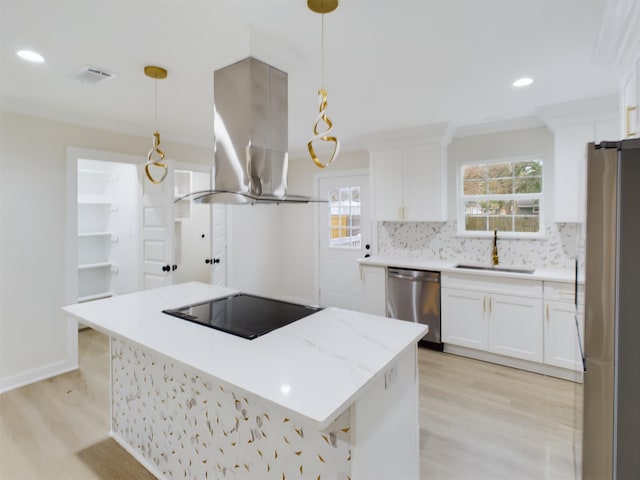 kitchen with pendant lighting, stainless steel appliances, white cabinets, and island exhaust hood