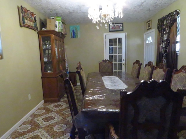 5055 Sunbury Dr, Beaumont, TX 77707 - dining space featuring a chandelier and a textured ceiling