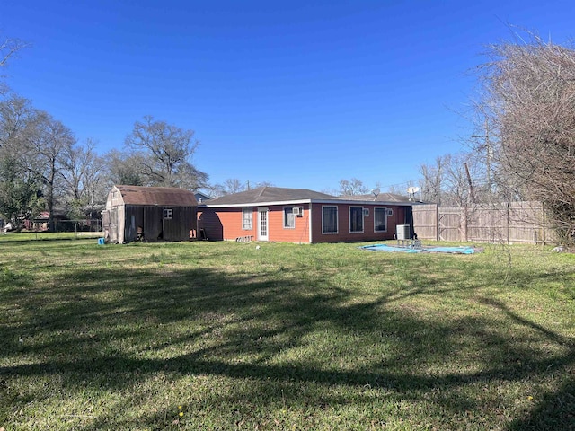 5055 Sunbury Dr, Beaumont, TX 77707 - back of house featuring a storage unit