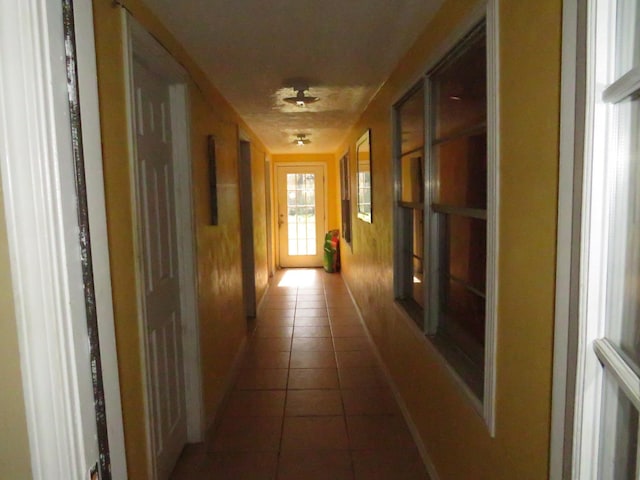 5055 Sunbury Dr, Beaumont, TX 77707 - hall featuring tile patterned floors and baseboards