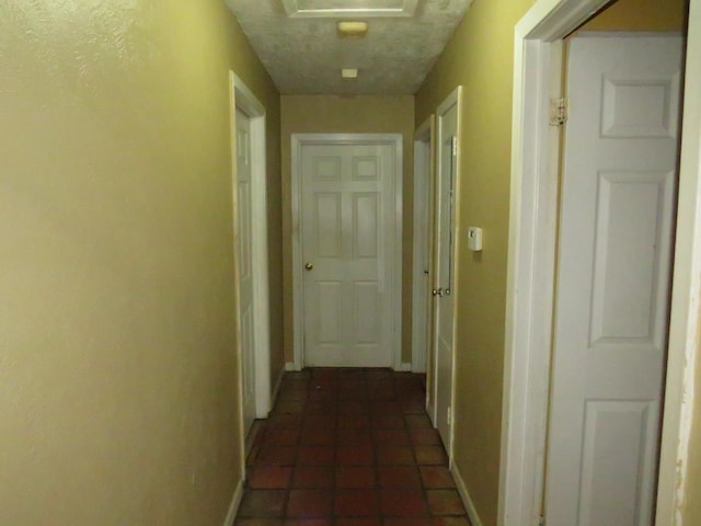 5055 Sunbury Dr, Beaumont, TX 77707 - hallway featuring baseboards and dark tile patterned floors
