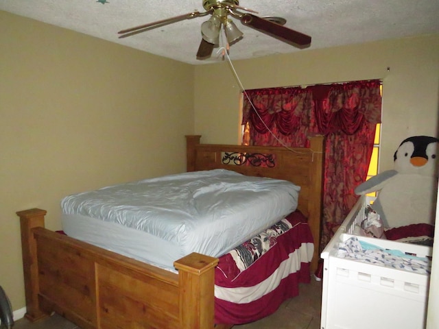 5055 Sunbury Dr, Beaumont, TX 77707 - tiled bedroom featuring ceiling fan and a textured ceiling