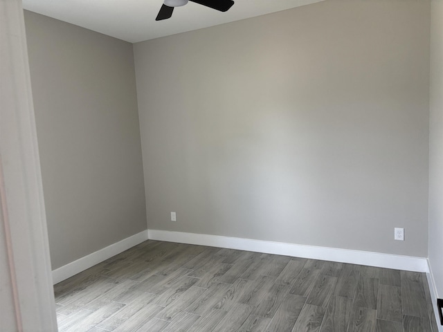 3240 Taft Ave, Groves, TX 77619 - empty room featuring baseboards, wood finished floors, and ceiling fan