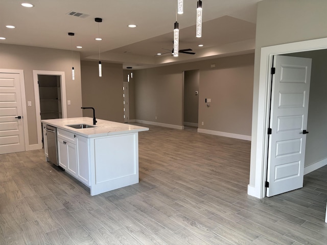 3240 Taft Ave, Groves, TX 77619 - kitchen featuring white cabinets, a sink, stainless steel dishwasher, and recessed lighting