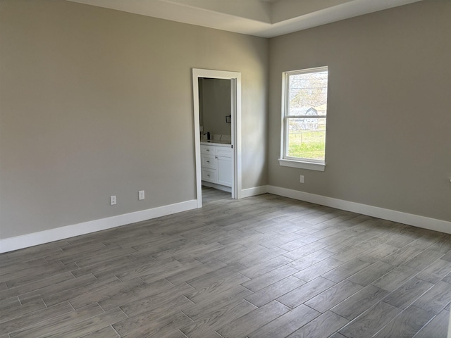 3240 Taft Ave, Groves, TX 77619 - spare room with baseboards and wood finished floors