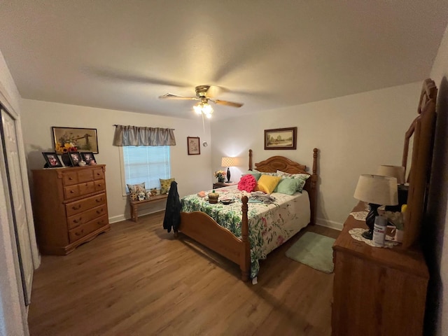 bedroom featuring hardwood / wood-style floors and ceiling fan