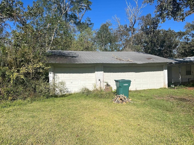 garage with a lawn