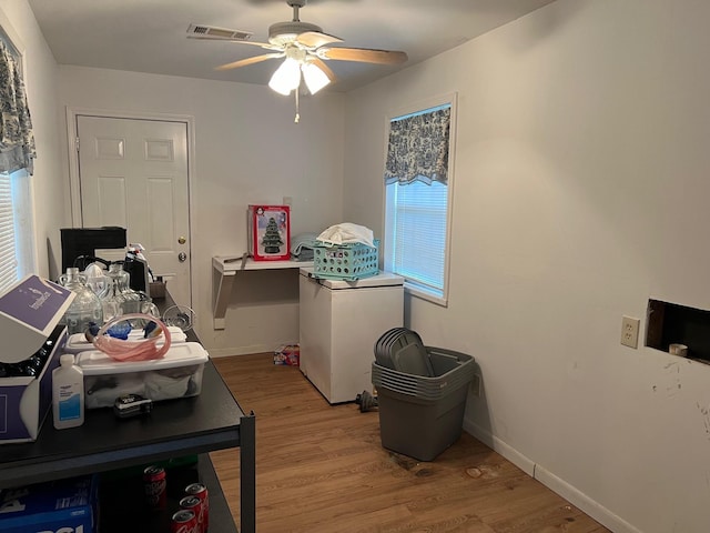 interior space featuring hardwood / wood-style flooring and ceiling fan