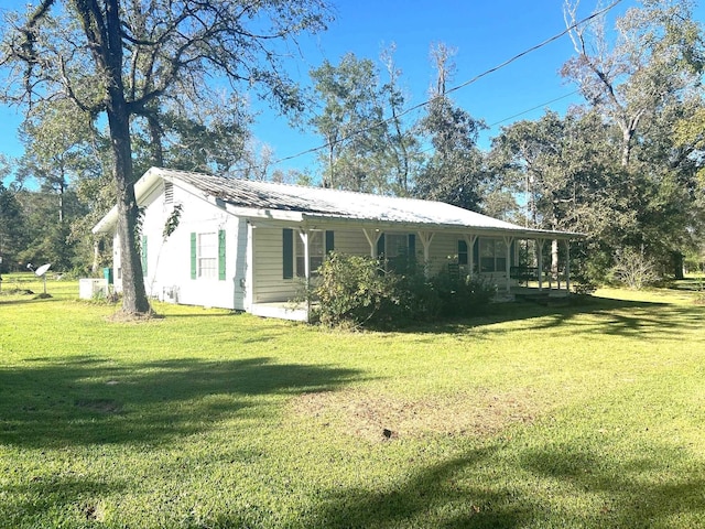 view of home's exterior featuring a lawn