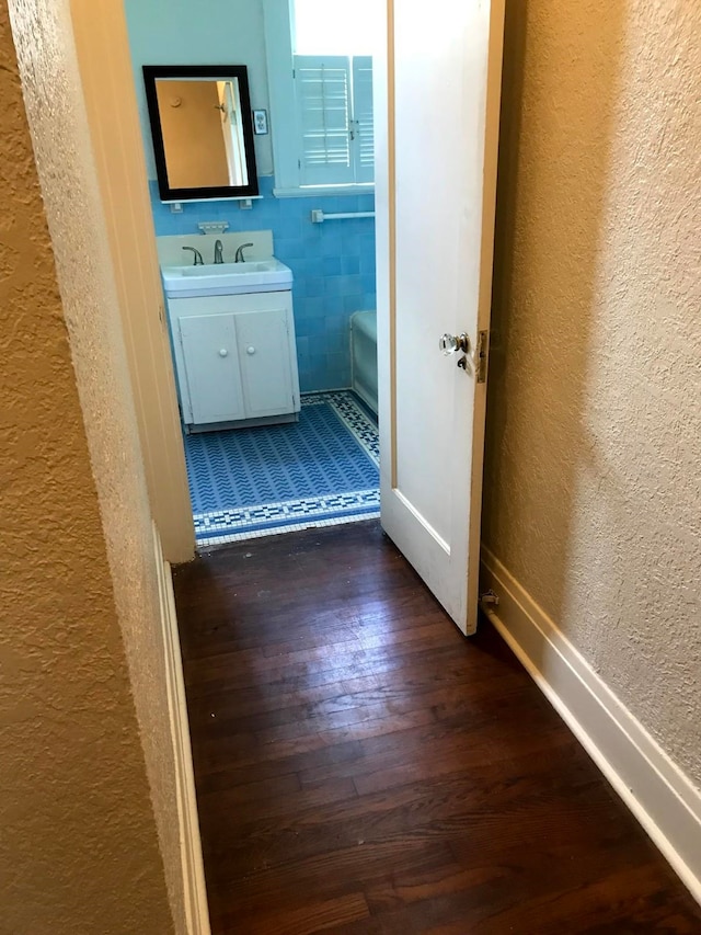 bathroom with vanity and wood-type flooring