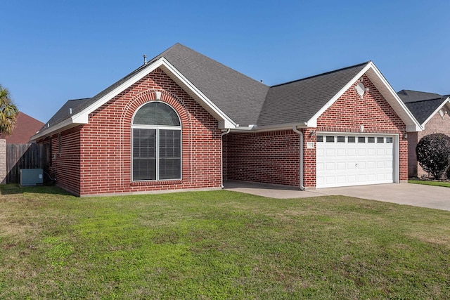 view of front of house with a garage, central air condition unit, and a front yard