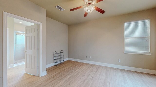 2635 Quiet Corral Ln, Port Arthur, TX 77640 - spare room featuring light wood finished floors, ceiling fan, and baseboards