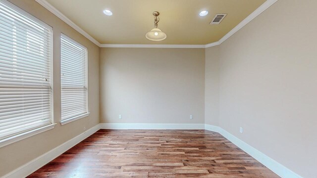 2635 Quiet Corral Ln, Port Arthur, TX 77640 - unfurnished room with crown molding, wood finished floors, plenty of natural light, recessed lighting, and baseboards