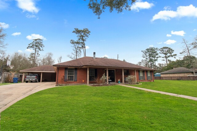304 Whipoorwill Dr, Silsbee, TX 77656 - ranch-style home with driveway, an attached carport, brick siding, and a porch