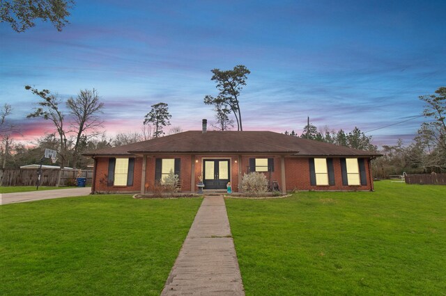 304 Whipoorwill Dr, Silsbee, TX 77656 - ranch-style home with french doors, brick siding, and driveway