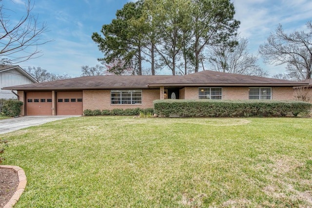 single story home with a garage, driveway, a front lawn, and brick siding