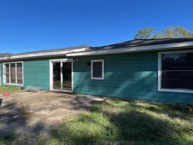 rear view of property featuring a patio area