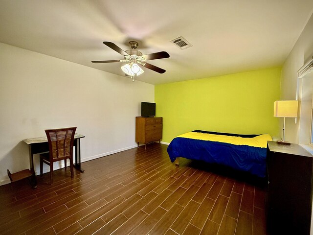 2940 36th St, Port Arthur, TX 77642 - bedroom with dark wood-type flooring and a ceiling fan