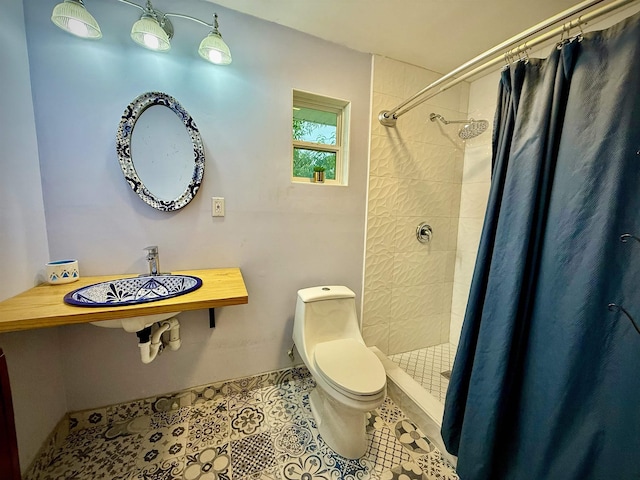 2940 36th St, Port Arthur, TX 77642 - bathroom featuring tiled shower and tile patterned floors