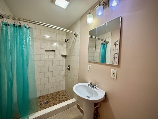 2940 36th St, Port Arthur, TX 77642 - bathroom with tiled shower and tile patterned floors