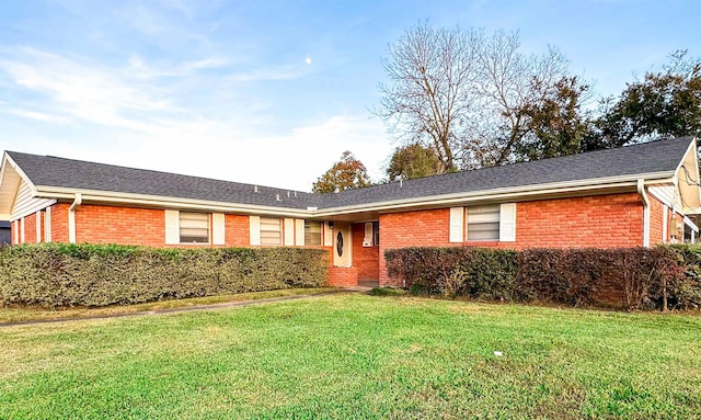 ranch-style house with a front yard