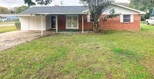 view of front of house with french doors and a front lawn