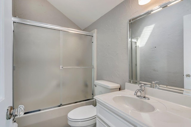 full bathroom featuring vanity, enclosed tub / shower combo, vaulted ceiling, and toilet