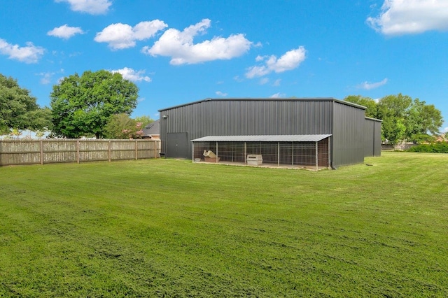 view of outdoor structure featuring a lawn