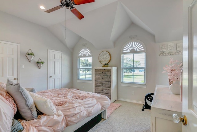 bedroom featuring ceiling fan, lofted ceiling, and light carpet