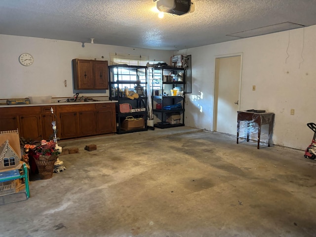 garage featuring sink and a garage door opener