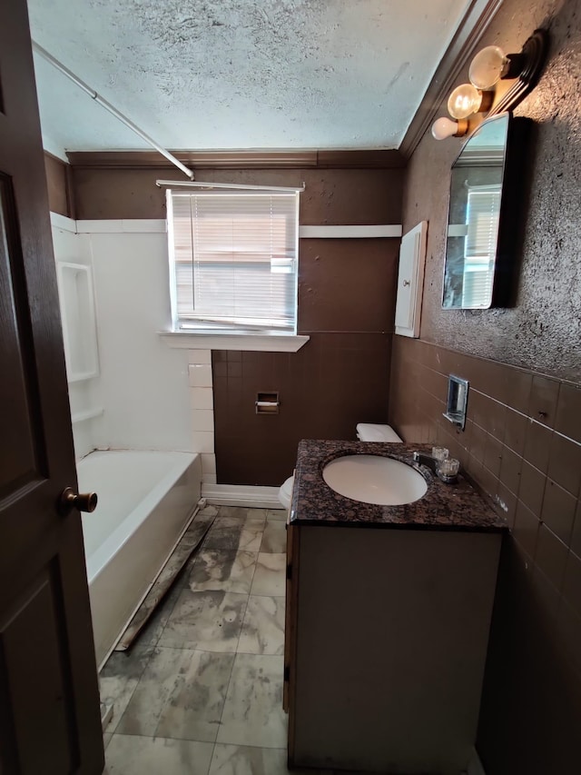 bathroom with vanity and a textured ceiling