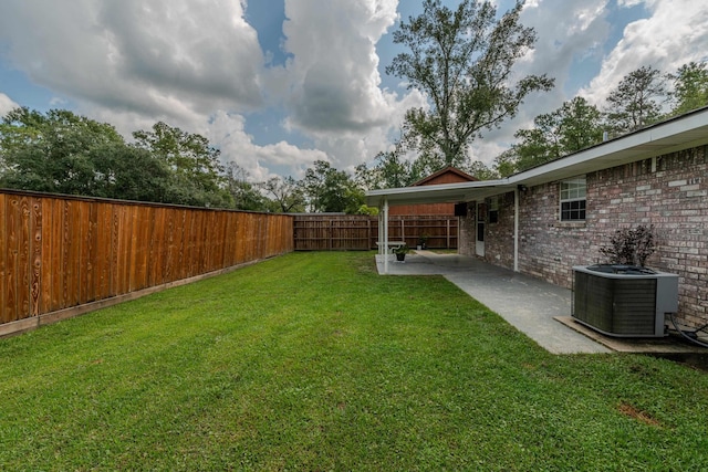 view of yard with a carport and cooling unit